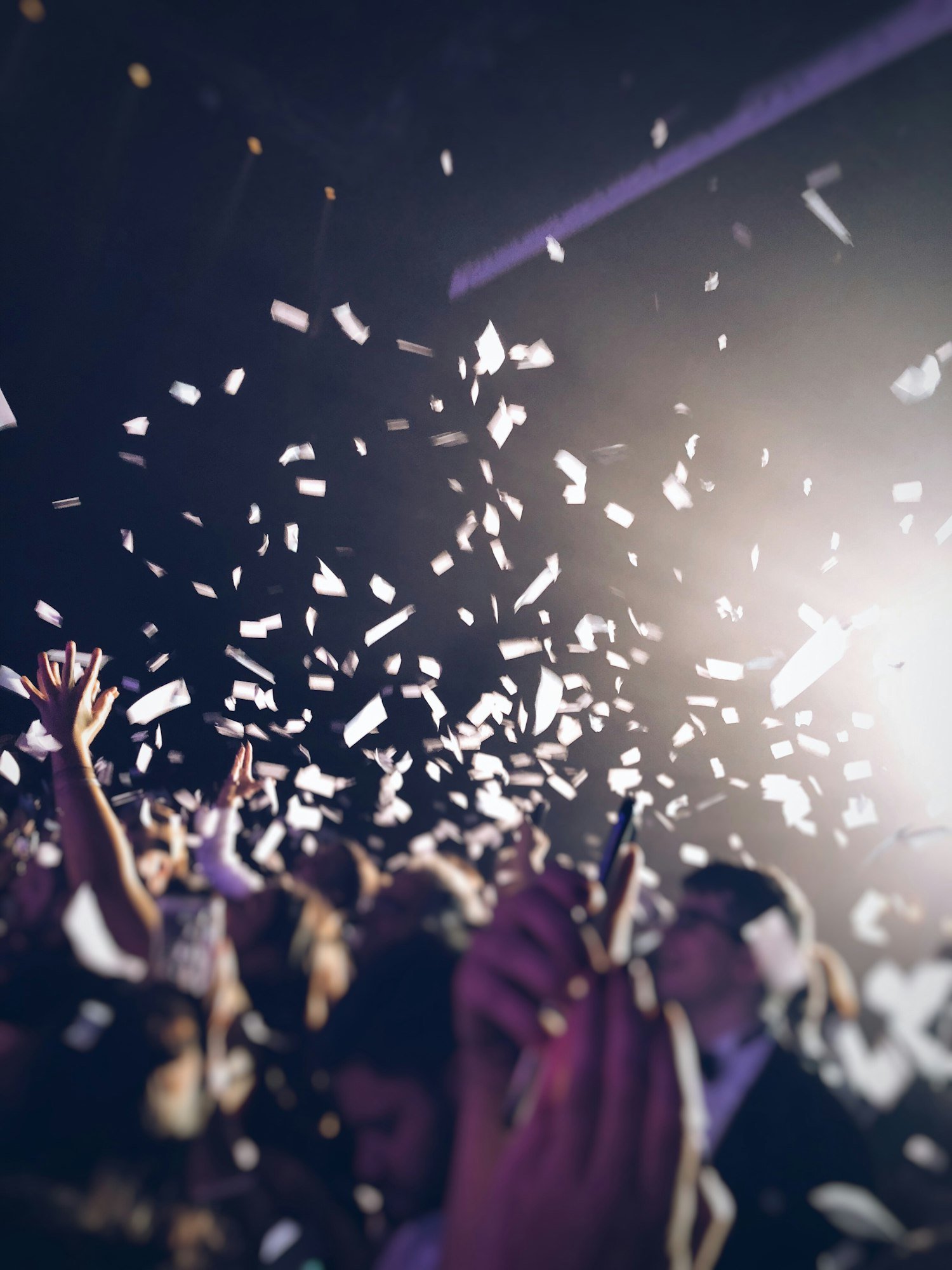 A crowd of people celebrating and dancing and having fun with confetti falling in Dubai UAE | Upshot SFX