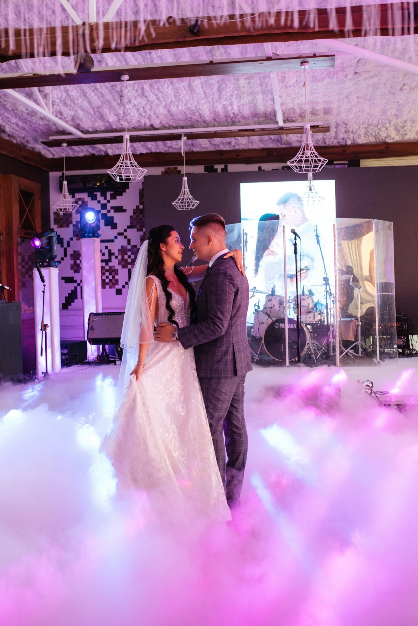 the first dance of the bride and groom inside a restaurant