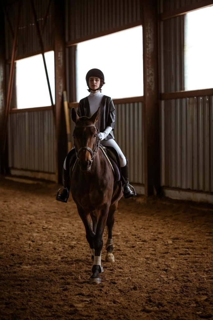 Young woman horse riding in race course in Dubai, UAE | Upshot SFX